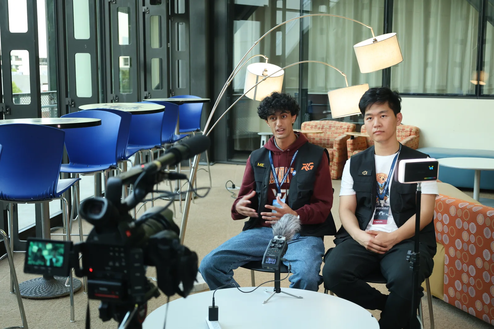 RoboGrinder members sharing their team's story during an interview